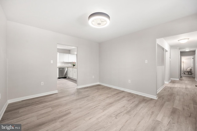 unfurnished room with light hardwood / wood-style floors