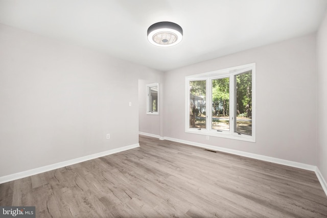 unfurnished room with light hardwood / wood-style floors