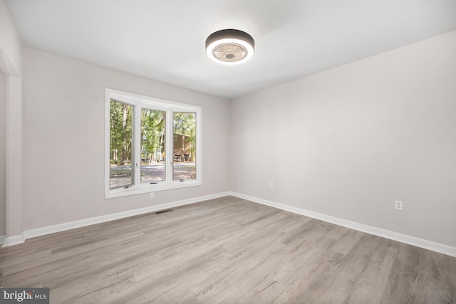 unfurnished room featuring light wood-type flooring