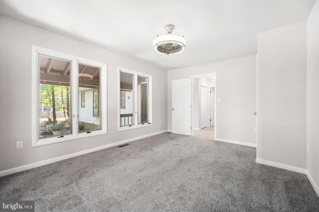 unfurnished room with carpet floors