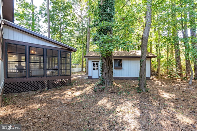 exterior space featuring a sunroom