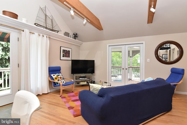 living room with french doors, vaulted ceiling with beams, light wood-type flooring, and rail lighting