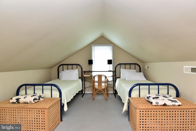 carpeted bedroom with vaulted ceiling