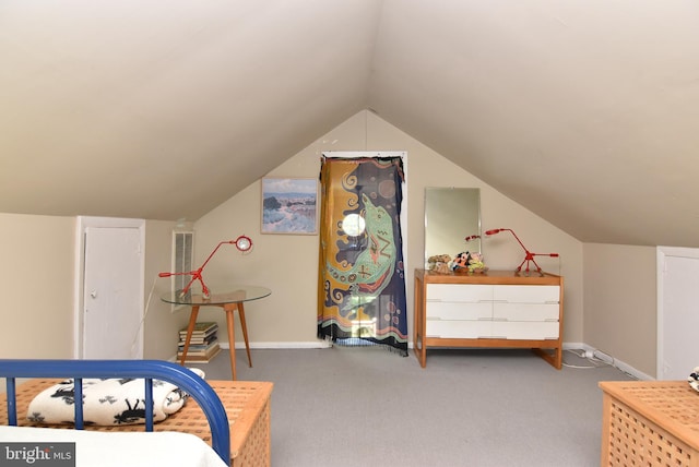 carpeted bedroom with vaulted ceiling