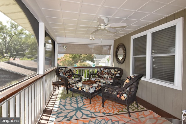 sunroom / solarium with ceiling fan