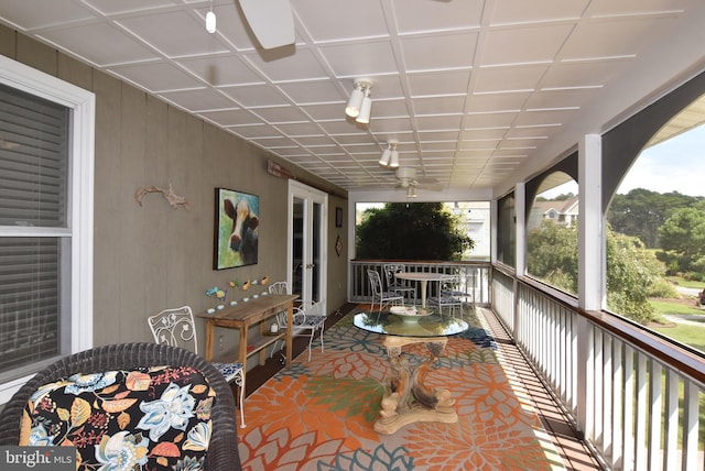 exterior space with ceiling fan