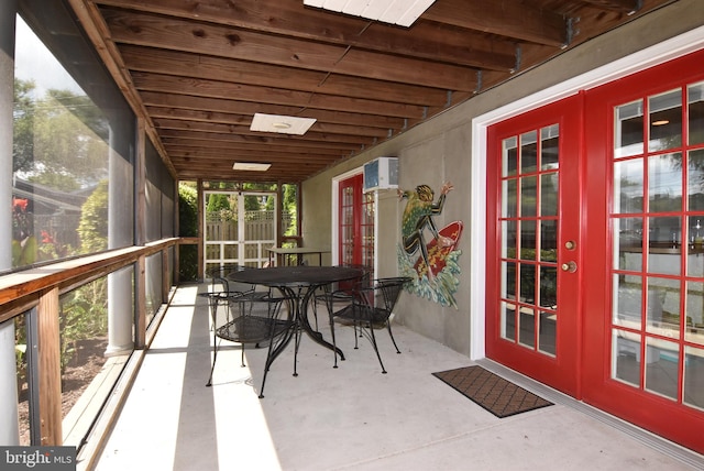 sunroom featuring french doors