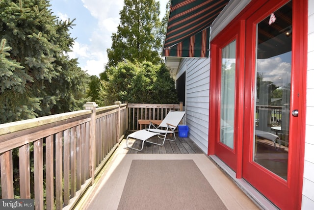 wooden balcony featuring a deck