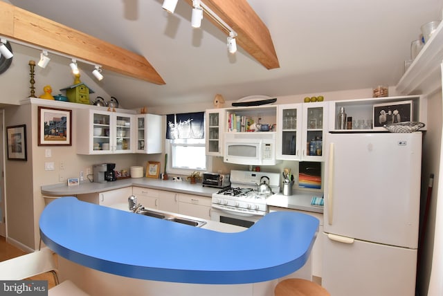 kitchen with lofted ceiling with beams, white appliances, white cabinetry, sink, and track lighting