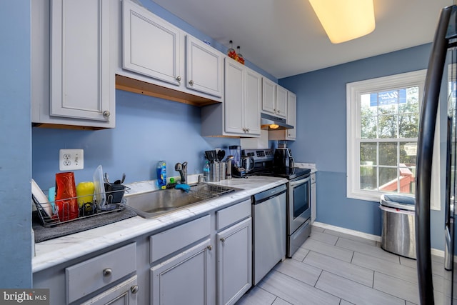 kitchen with appliances with stainless steel finishes and sink