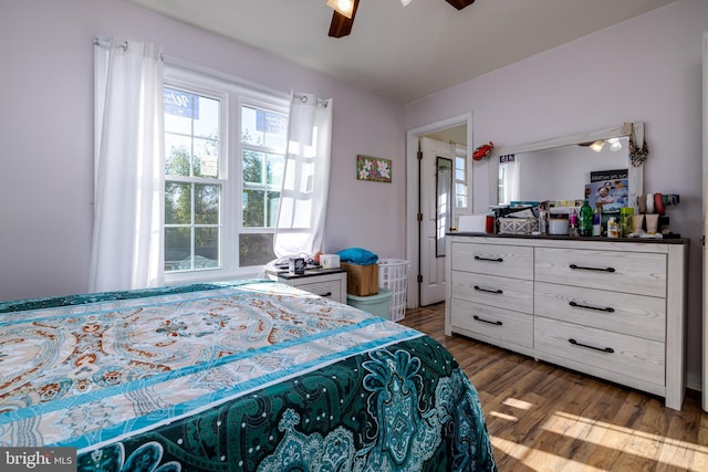 bedroom featuring ceiling fan and dark hardwood / wood-style flooring