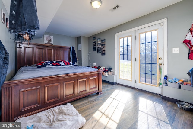 bedroom with hardwood / wood-style flooring