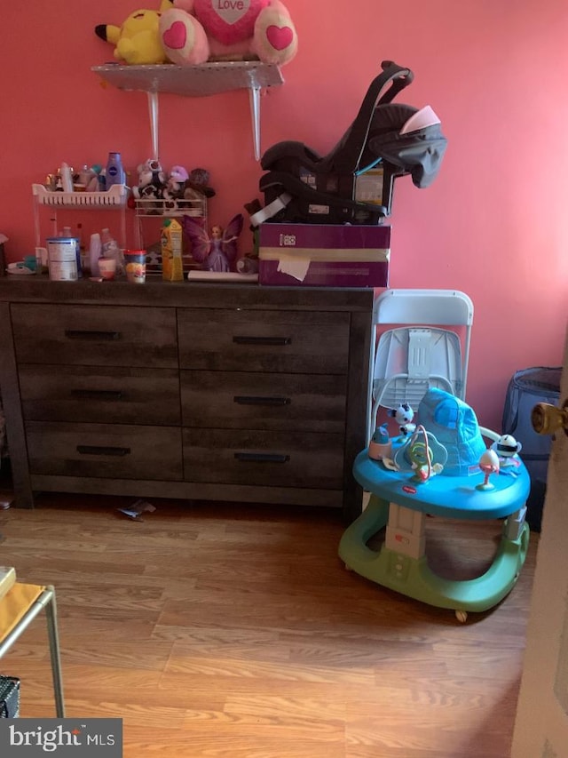 bedroom with wood-type flooring