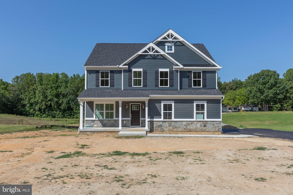 craftsman inspired home featuring covered porch