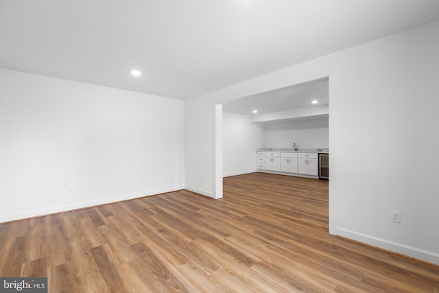 unfurnished living room with light hardwood / wood-style flooring