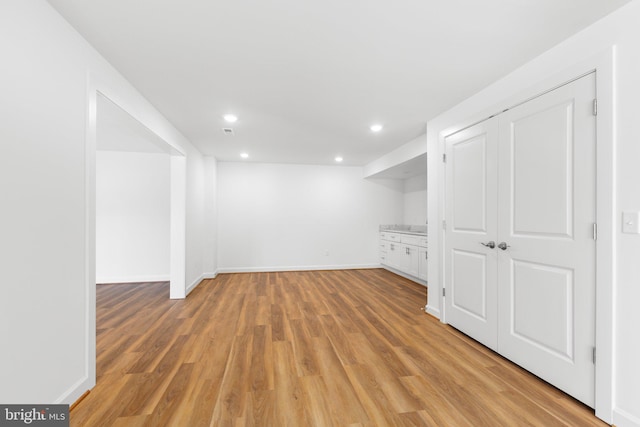 basement with light wood-type flooring