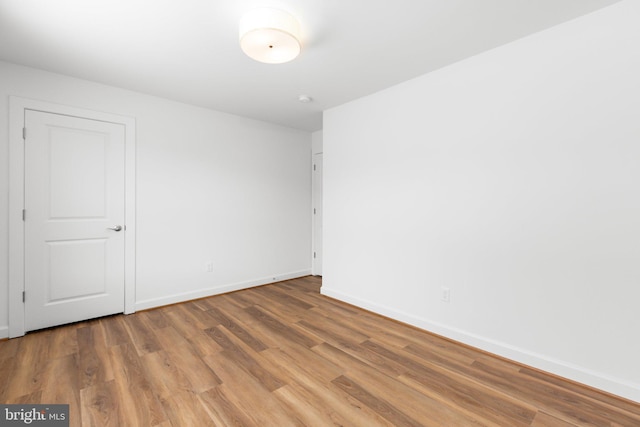 empty room featuring hardwood / wood-style floors