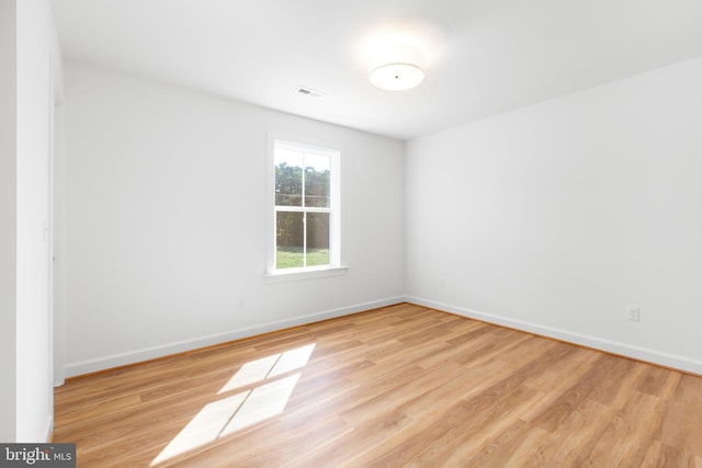 empty room with light hardwood / wood-style floors