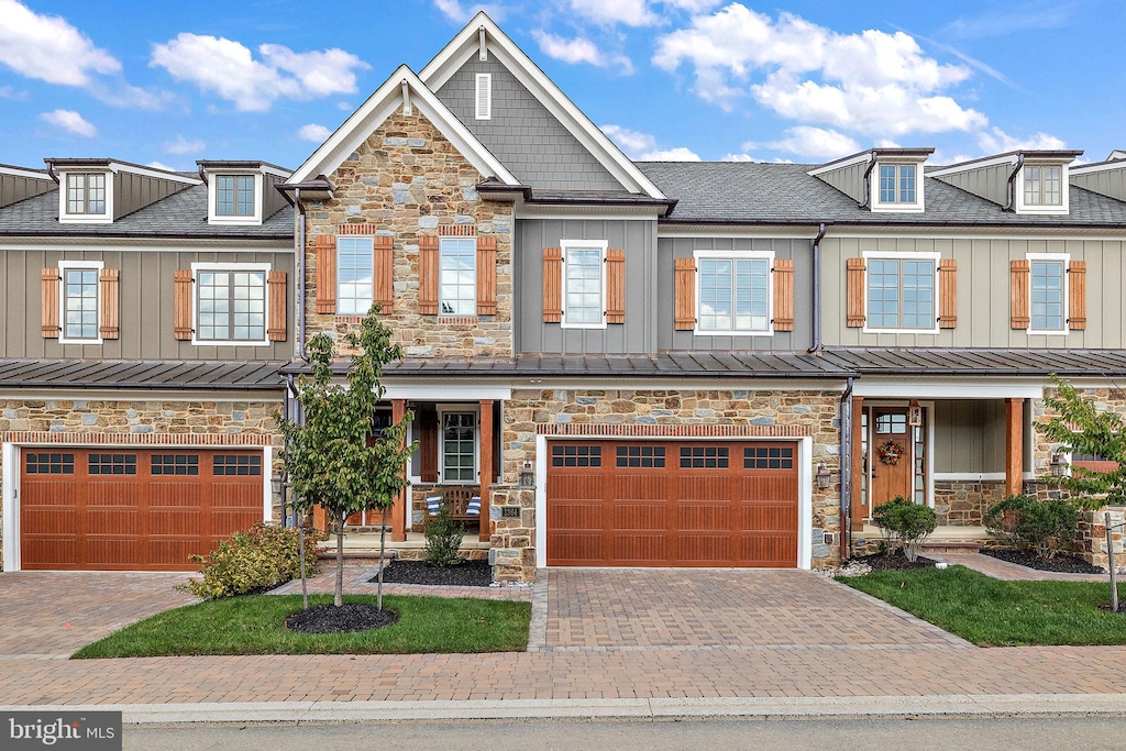 view of front of home featuring a garage and a porch