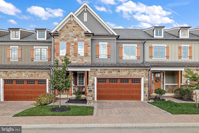 view of front of home featuring a garage and a porch