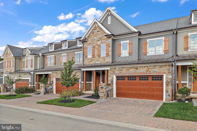 multi unit property featuring a garage