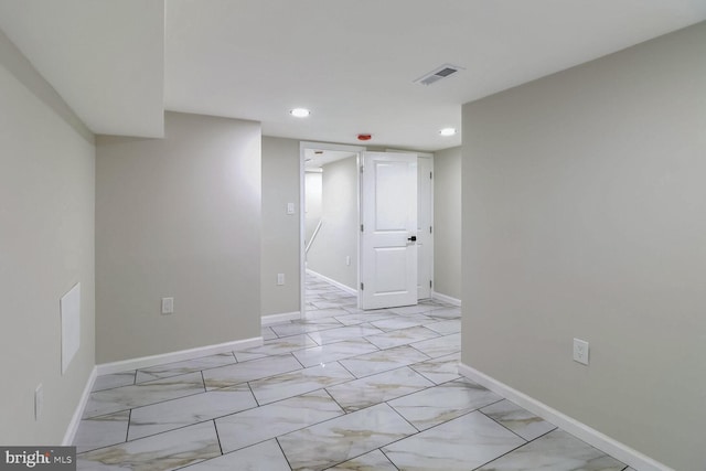 unfurnished room featuring recessed lighting, visible vents, marble finish floor, and baseboards