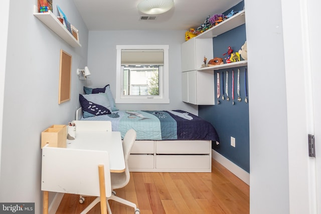 bedroom featuring light wood-type flooring