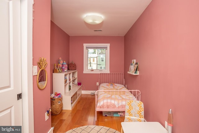 bedroom with light wood-type flooring