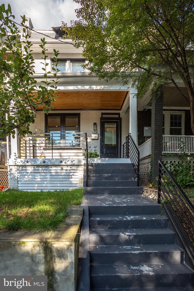 entrance to property with a porch