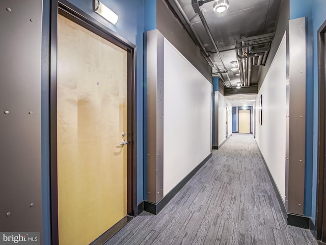 corridor featuring dark hardwood / wood-style flooring