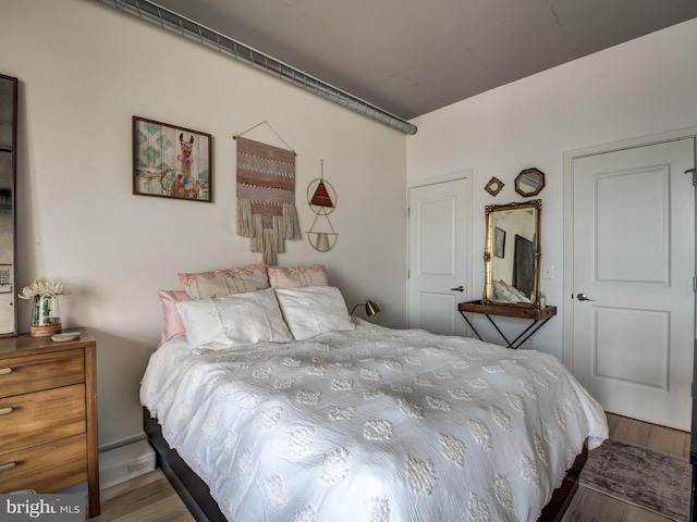 bedroom with hardwood / wood-style flooring