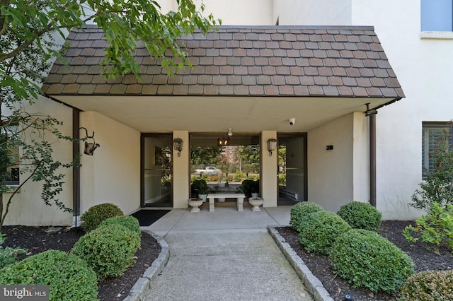 property entrance featuring a patio area