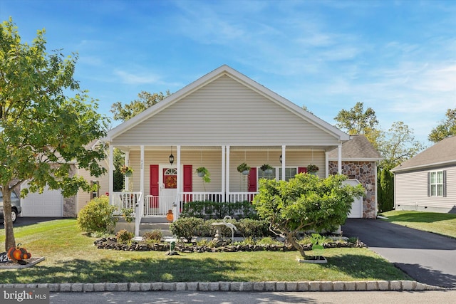 view of front of home with a porch and a front yard