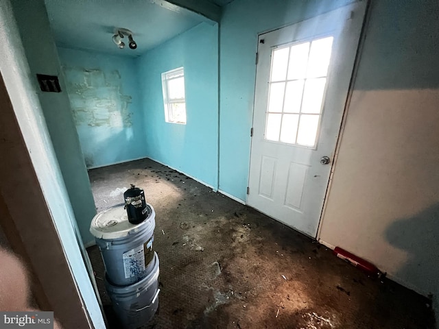 doorway to outside featuring concrete flooring