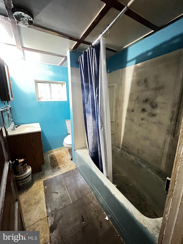 full bathroom featuring shower / bath combo, toilet, and vanity