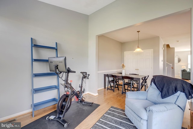 workout area featuring hardwood / wood-style floors