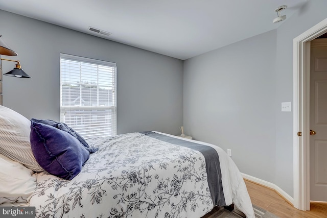 bedroom featuring hardwood / wood-style floors