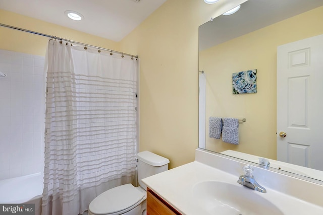 full bathroom with vanity, toilet, and shower / bathtub combination with curtain