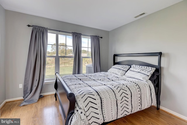 bedroom featuring hardwood / wood-style flooring