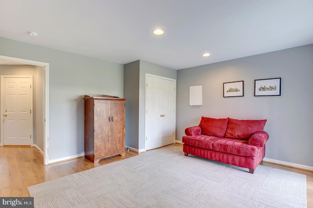 sitting room featuring light hardwood / wood-style flooring