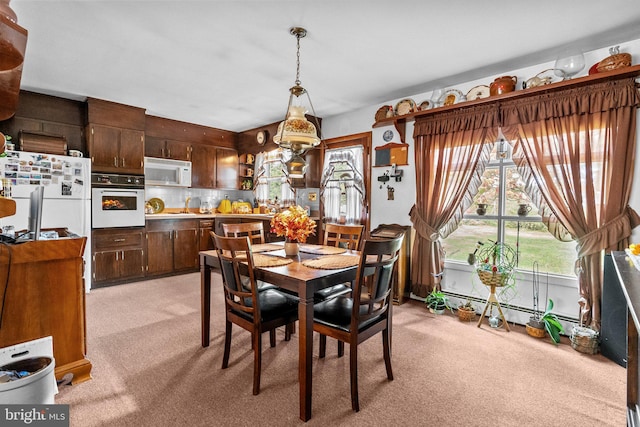 view of carpeted dining area