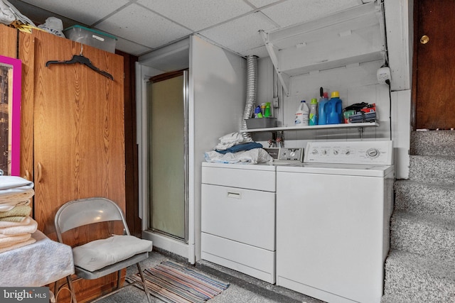 clothes washing area with carpet floors and washer and dryer