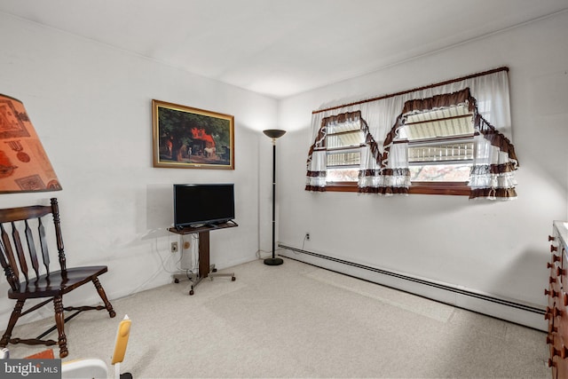 living area with baseboard heating and carpet