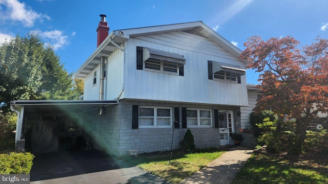 view of front of property with a carport