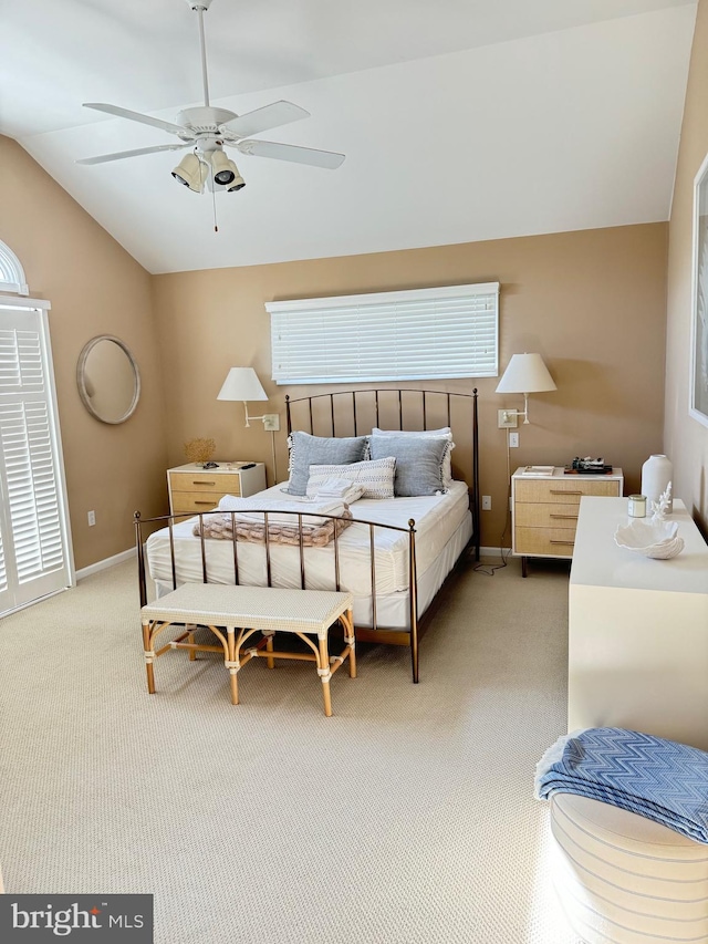 bedroom with lofted ceiling, light carpet, and ceiling fan