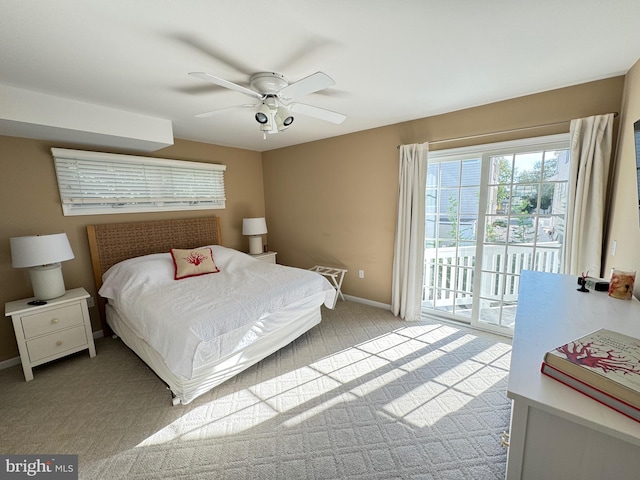 carpeted bedroom with access to outside and ceiling fan