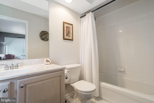 full bathroom with tile patterned floors, shower / bath combo with shower curtain, vanity, and toilet