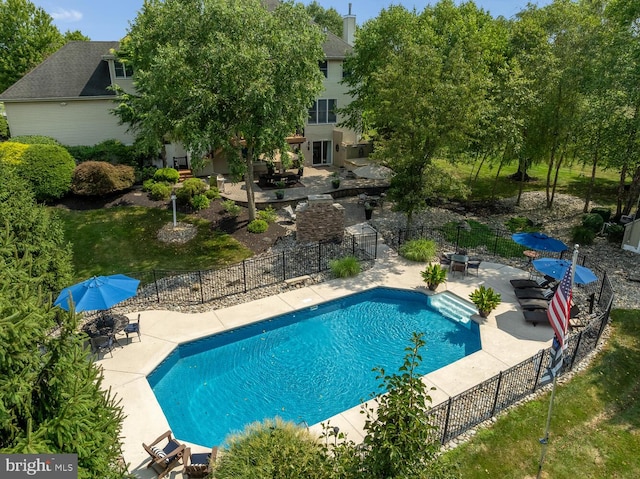 view of swimming pool featuring a patio