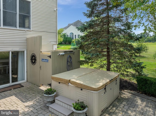 view of patio / terrace featuring a hot tub