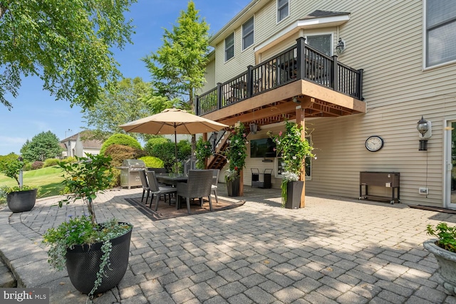 view of patio / terrace featuring area for grilling and a deck